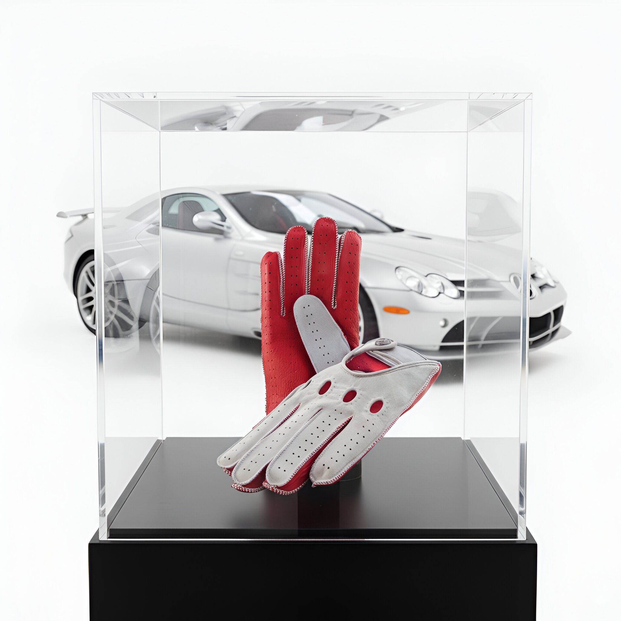 red and suede grey leather driving gloves in front of Mercedes Stirling moss